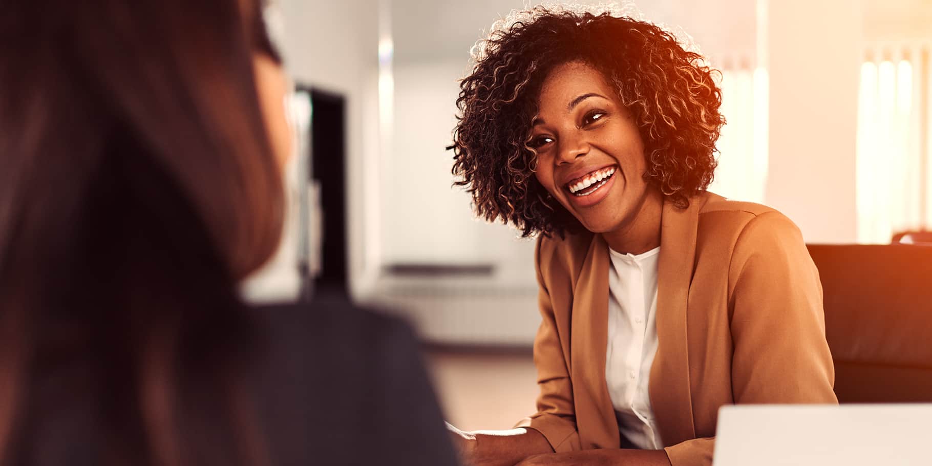 A professional woman attending to a customer.